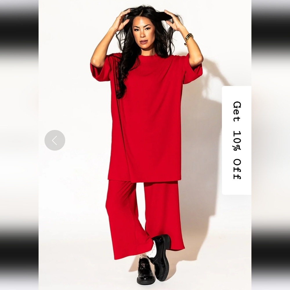Dressed in Lala Lex Ribbed Playsuit in Cherry Red